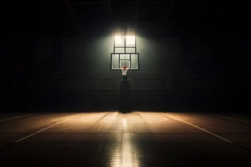Fotobehang Empty, basketball court illuminated by spotlight above, back board and basketball net © David