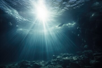 Fototapeta na wymiar Underwater background of shafts of light coming through surface, illuminating the bottom of the Sea