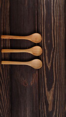Mockup wooden spoons on natural wood table, spoon template