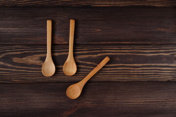 Mockup wooden spoons on natural wood table, spoon template