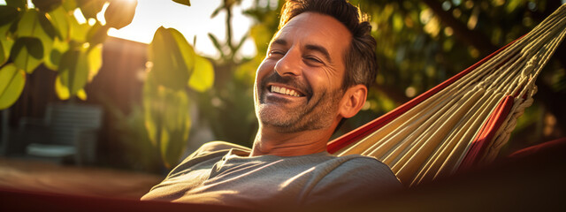 Relaxed man rests lying in a hammock