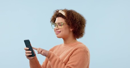 Phone, news and happy woman in studio for social media, text or chat on blue background. Smartphone, search and female model online for meme, contact or sign up app, email or message communication