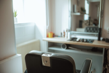 modern beauty salon with chairs and mirror