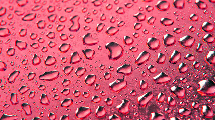 Drops of water on a colored background. Abstract texture