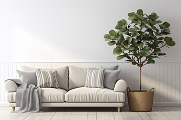 Silver velvet sofa, pillows, and leaf tree in wicker basket on white wall background in living room