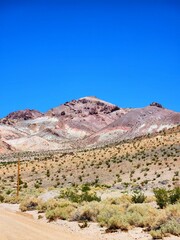 Brightly-colored layered sediment mountains in Beatty, Nevada