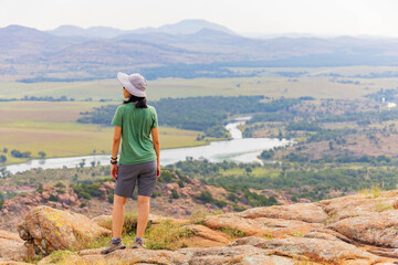 Woman hiking in the Elk Mountain Trail of the Wichita Mountains National Wildlife Refuge