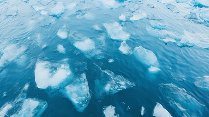 Fototapeta premium Top-down view of icebergs floating in sapphire Arctic waters. beautiful and marvelous still sea and ice floes. generative AI