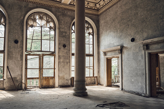  Abandoned soviet spa resort (sanatorium) Shakhter (Miner), in Tskaltubo, Georgia. Luxurious ancient hall with columns, painted ceiling, arched windows. Stalin Empire style
