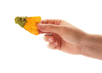 Woman holding delicious nachos chip with guacamole on white background, closeup