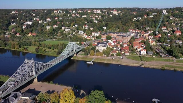 Drone photo, drone shot, drone video, drone flight over the Elbe bridge Blaues Wunder and the district of Loschwitz with a view of Koernerplatz, Elbflorenz, sunshine, blue sky, suspension railway