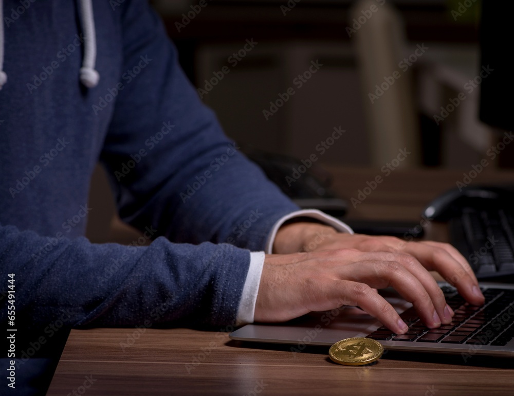 Poster male hacker hacking security firewall late in office