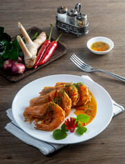 Dried Red Curry-fried with Shrimps on the wooden table - Thai food style