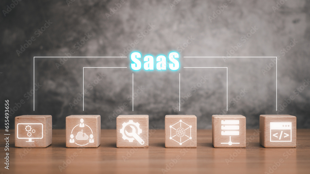 Aufkleber saas, software as a service concept, wooden block on desk with software as a service icon on virtual