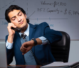 Financial specialist working late in the office
