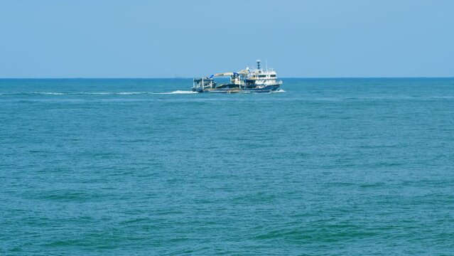 Fishing Boat Sails For Fishing. Fishing Boat In The Middle Of The Sea. Real time.