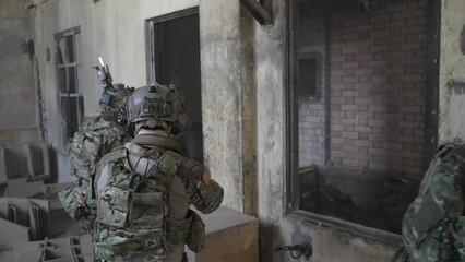 Soldier in civil war, ruined building. Close quarter battle and civil war concept.