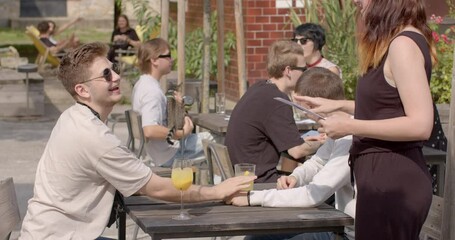 Two guys at the table to meet and connect with potential partners. Event welcomes and supports people of diverse sexual orientations and gender identities, creating inclusive and accepting environment