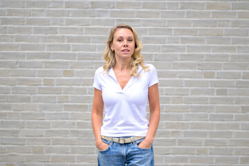 Upper body portrait of an attractive blonde woman with an arrogant look