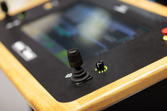 control console with two joysticks and touchscreen