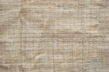 Fototapeta na wymiar brown sackcloth texture background, crumpled burlap fabric textile for design