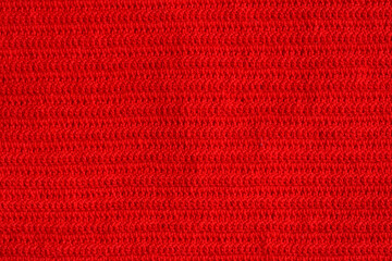 texture of red wool knitted yarn, woolen fabric background - obrazy, fototapety, plakaty