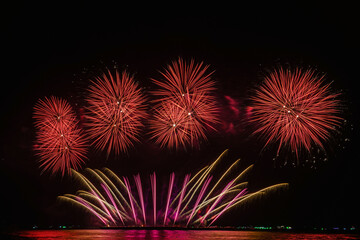 fireworks of various colors at night with celebration and anniversary concept