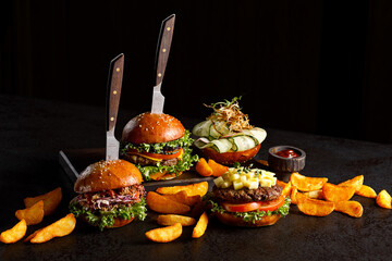 hamburgers with fried potato and sauces