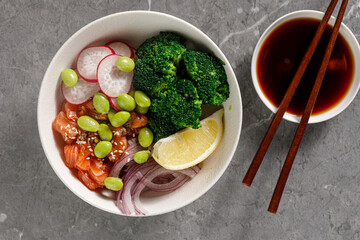 bowl of salad with salmon fish and seaweed