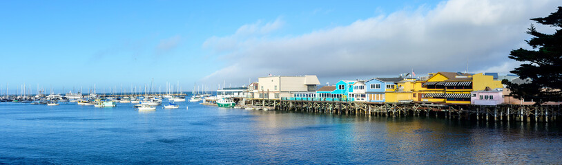 Scenic panoramic view of Monterey Old Fisherman's Wharf and marina with moored yachts on sunny day