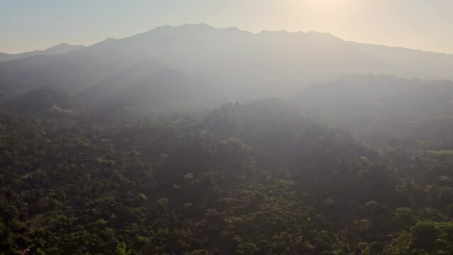 Day's Onset Over Peaks And Woods