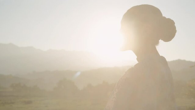 Side View Of Woman Against Early Daylight