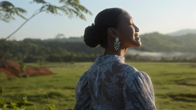 Lady On A Field Smiles Under The Warm Sunlight