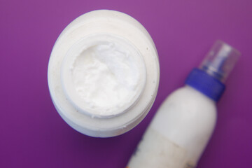 Bottle of Glue Spilling on black background .