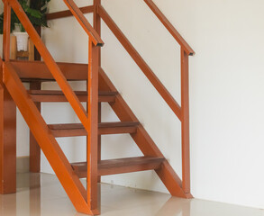 wooden staircase with ladder