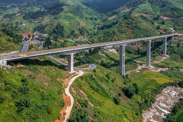 Top aerial view of the Mong Sen Bridge on 4D national road from Sapa town to Lao Cai city, Vietnam. © Dong