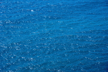 Sea surface with small waves. Blue water background. Marine texture.