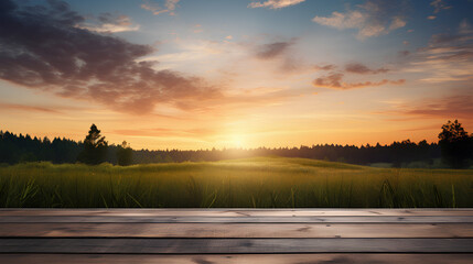 Empty wooden tabletop and sunset over grass field landscape background. 
