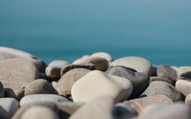 Fototapeta na wymiar beautiful pebbles on the seashore close-up