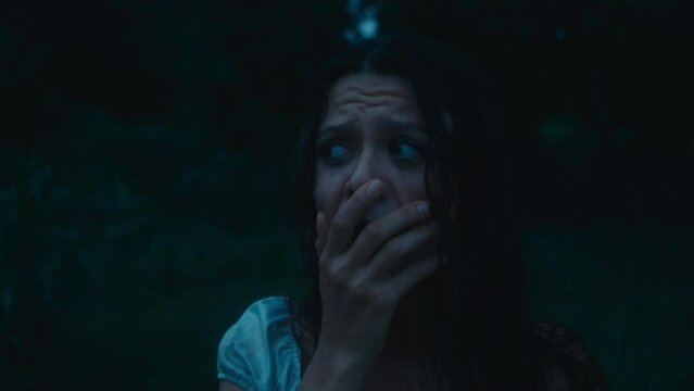 A frightened girl in a bloody dress got lost in the woods