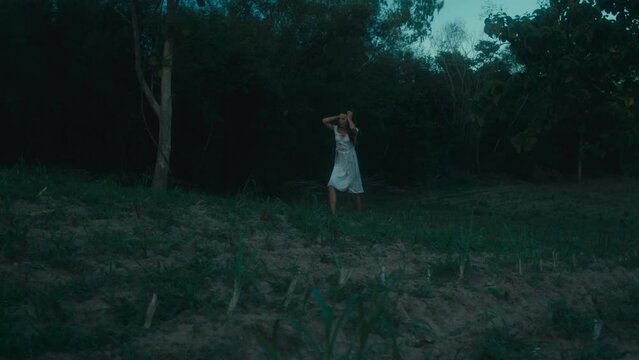 A frightened girl in a bloody dress got lost in the woods