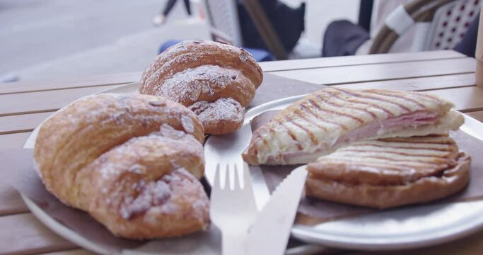 Close Up of Croissants and a Croque Monsieur Sandwich at a Cafe