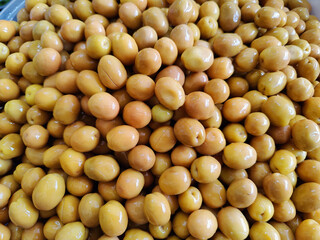 green olives lined up on the counter
