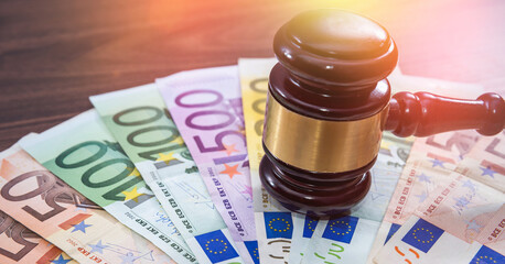 Judge's gavel on Eu paper Euro banknotes. Corruption and bribery concept