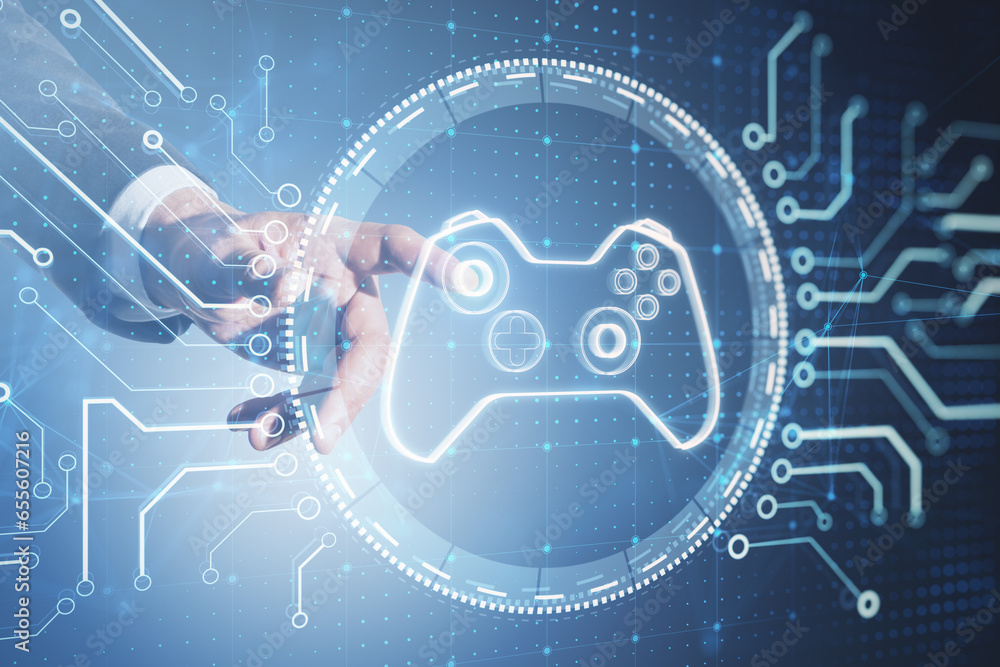 Poster close up of businessman hand pointing at creative joystick or gamepad hologram on blurry background.