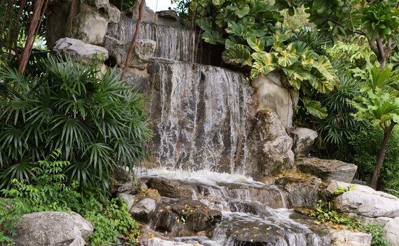 a waterfall in a garden.