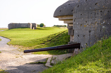 Two bunkers holding each a 150 mm gun in the Longues-sur-Mer battery in Normandy, France, a WWII...