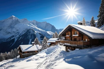 Fotobehang Winter ski chalet and cabin in snowy mountain landscape in © Creative Clicks