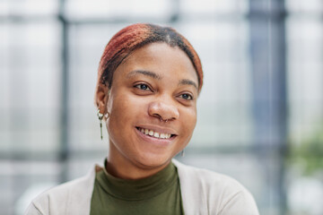 Close-up photo of a pretty, pensive dark-skinned girl, student, manager, secretary, freelancer