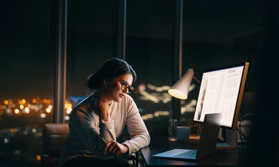 Business woman having a nighttime virtual meeting in her office